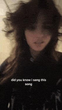 a woman is singing a song with the words " did you know i sang this song "