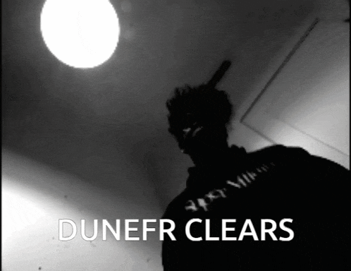 a black and white photo of a person with the words dunefr clears below them