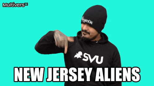 a man with a beard wearing a svu sweatshirt says new jersey aliens