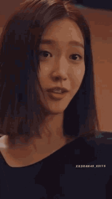 a close up of a woman 's face with the words xkdramas edits visible