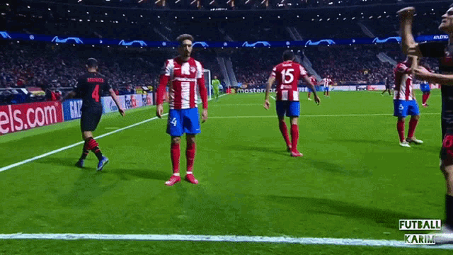 soccer players on a field with the number 15 on their jersey