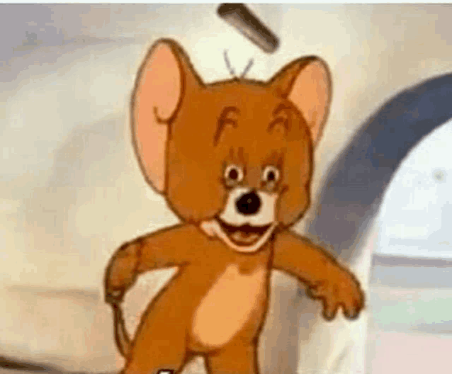 jerry from tom and jerry is smiling and holding a stick in his hand .