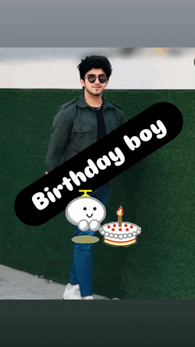 a man standing next to a birthday cake with a candle