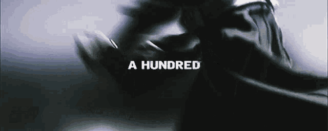 a hundred is written on a black background