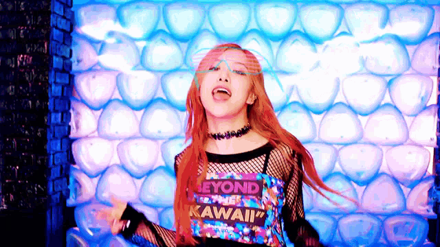 a woman wearing a shirt that says beyond kawaii is dancing