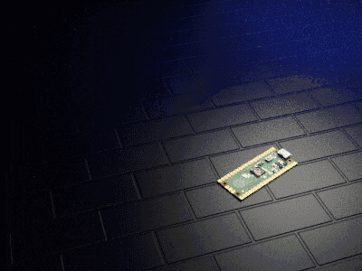 a motherboard is laying on a brick floor in a dark room