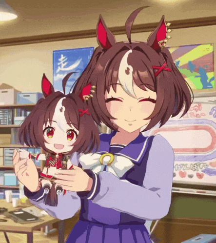 a girl holding a stuffed animal in her arms
