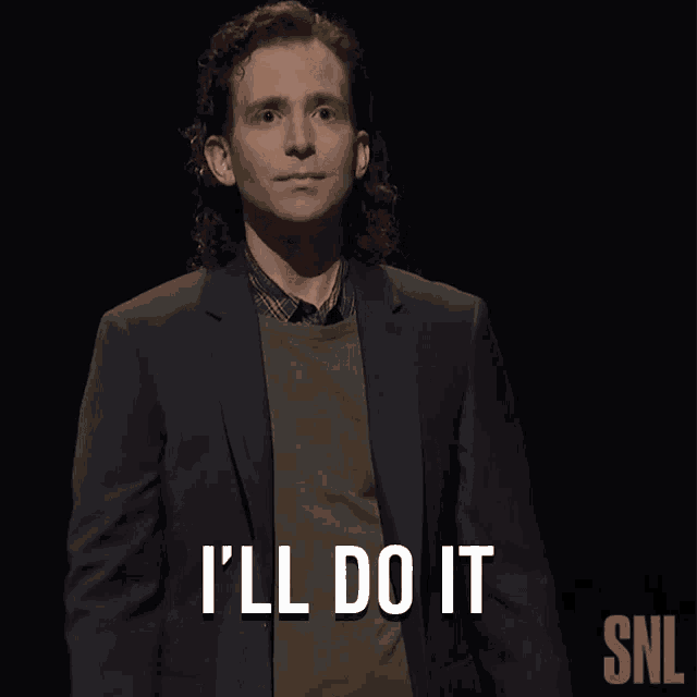 a man in a suit says i 'll do it in front of a snl logo