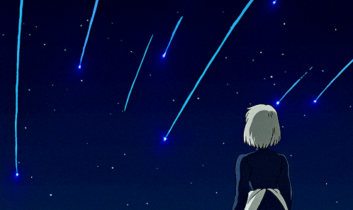 a person looking up at a starry sky with shooting stars