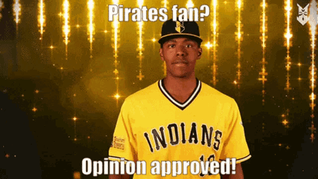 a man wearing a yellow indians jersey is giving a thumbs up