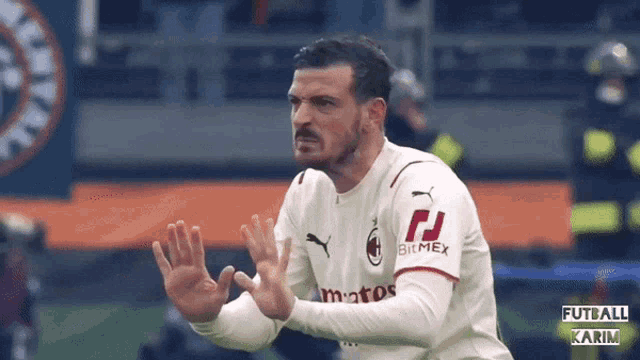 a soccer player wearing a jersey that says bitmex on the sleeve
