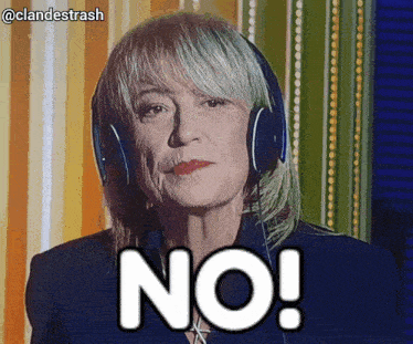 a woman wearing headphones says " no " in front of a striped wall