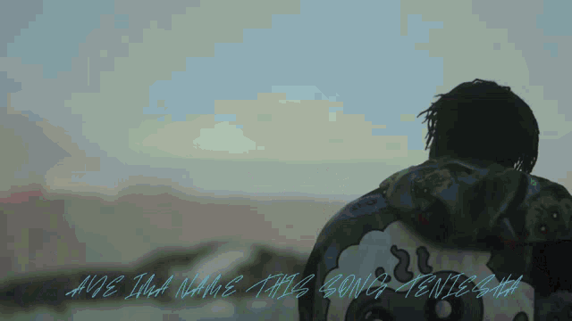 a man in a hoodie stands in front of a cloudy sky with the words " are i that name this song tenissa "