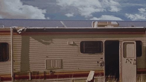 a camper with the word rv on the side