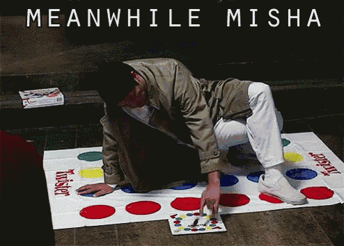 a man is playing a twister game on the floor