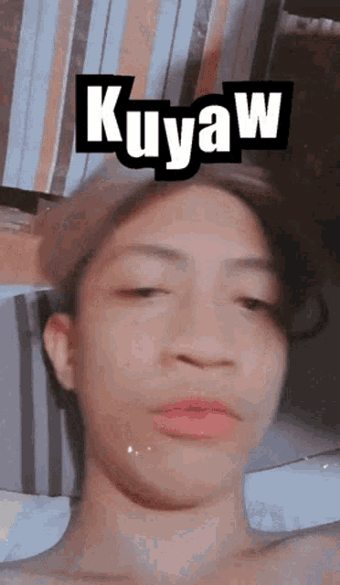 a close up of a person 's face with kuyaw written on the top
