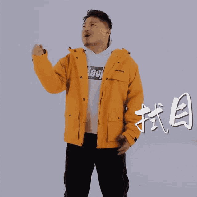 a man wearing a yellow jacket that says jeep on the front