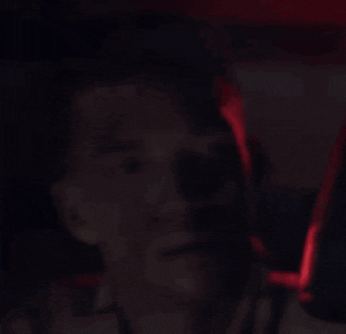 a close up of a man 's face with blood coming out of it .