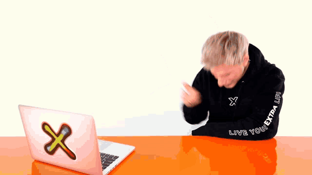 a man wearing a black hoodie that says " live your extra life "