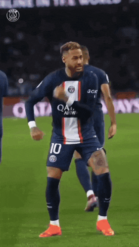 a soccer player wearing number 10 is dancing on the field