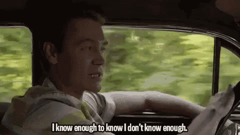 a man is driving a car and saying `` i know enough to know i don 't know enough ''