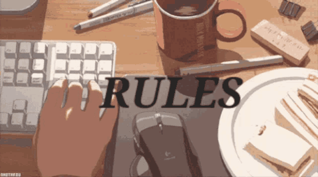 a person is typing on a keyboard with the word rules written on it