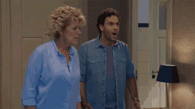 a man and a woman are standing next to each other