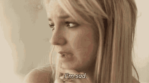 a woman with blonde hair is crying and saying `` i 'm sad '' .