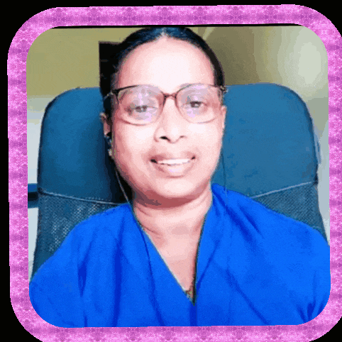 a woman wearing glasses and a blue shirt smiles for the camera