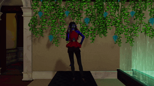 a woman with blue eyes is standing in front of a wall with ivy hanging from it