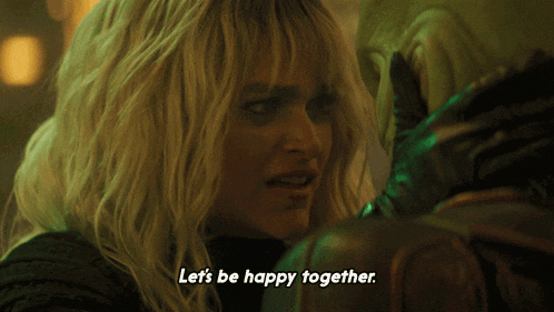 a woman says " let 's be happy together " in a dark room