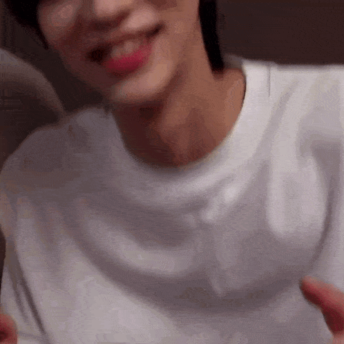 a close up of a person wearing a white shirt .