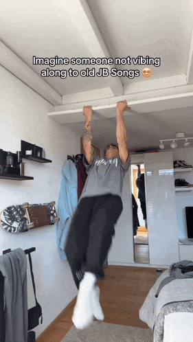 a man hangs upside down in a bedroom with a caption that says imagine someone not vibing along to old jb songs