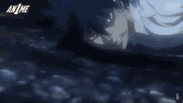 a man is laying on the ground with the word anime in the corner