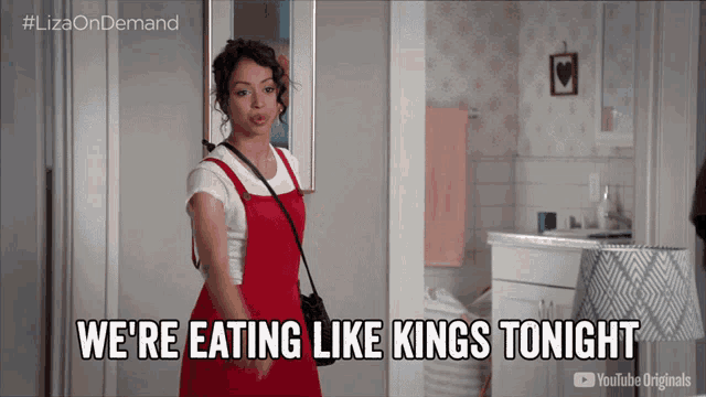 a woman says we 're eating like kings tonight while standing in a room