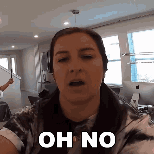 a woman says oh no in front of a computer