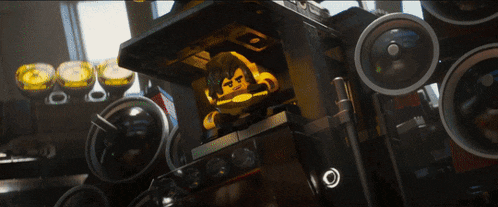 a lego figure is sitting inside of a speaker