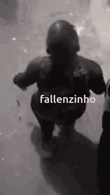 a black and white photo of a person with the words fallenzinho written on it