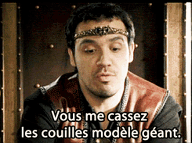 a man with a crown on his head is sitting on a throne and says vous me cassez les couilles modele geant