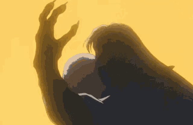 a close up of a monster 's hand reaching out towards the camera on a yellow background .