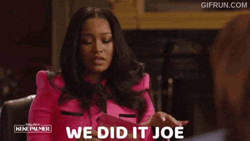 a woman in a pink jacket with the words we did it joe