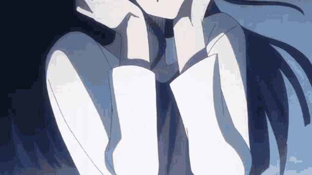 a girl with long black hair and a white shirt is sitting down with her hands on her head