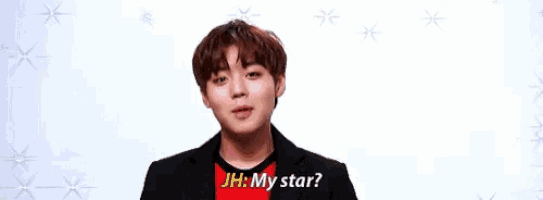 a young man is making a funny face and saying `` my star ? ''