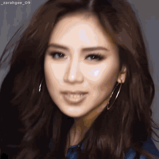 a close up of a woman 's face with the hashtag zarahgee_09