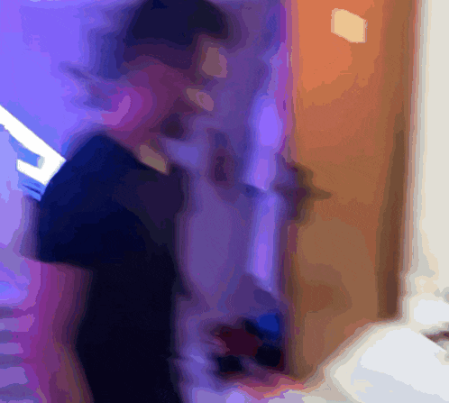 a blurry picture of a person standing in a room