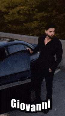 a man sitting on the front of a mercedes with the name giovanni written on the bottom