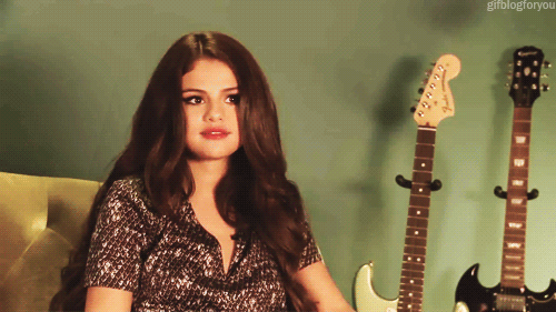 Selena Gomez GIF - Selena Gomez Shrug Maybe GIFs