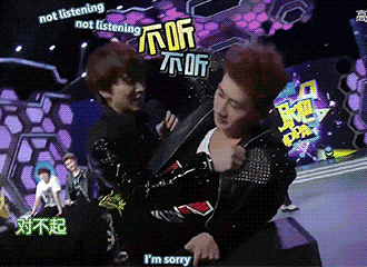 a man says i 'm sorry while another man holds his jacket