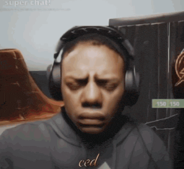 a man wearing headphones has the word ced written on his chest