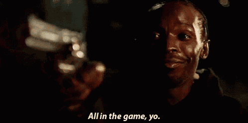 a man is pointing a gun at the camera and saying all in the game yo
